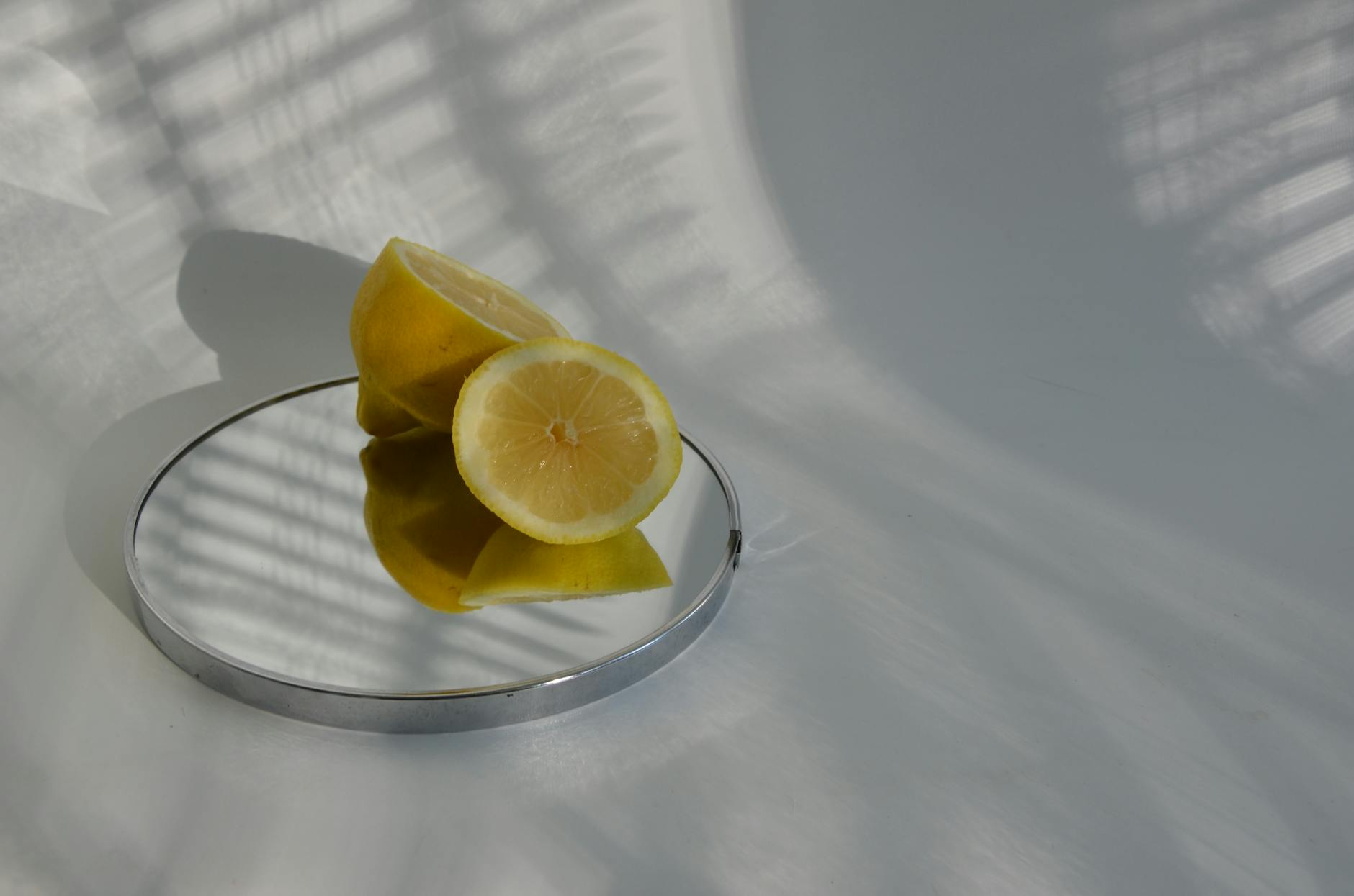 Bright yellow lemons arranged on a pastel green background, symbolizing freshness and partnership